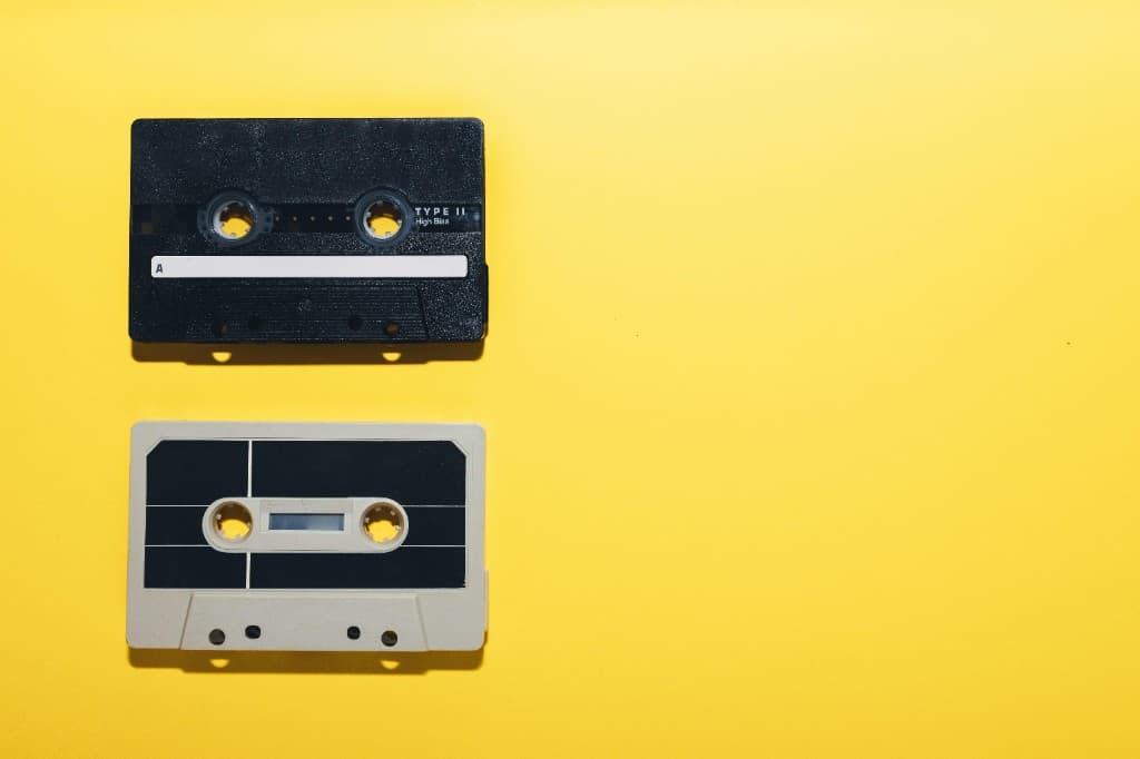 Two cassettes on yellow